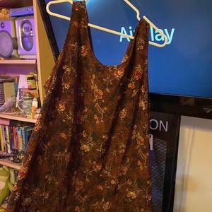 Red dress with green and black detailing/flowers